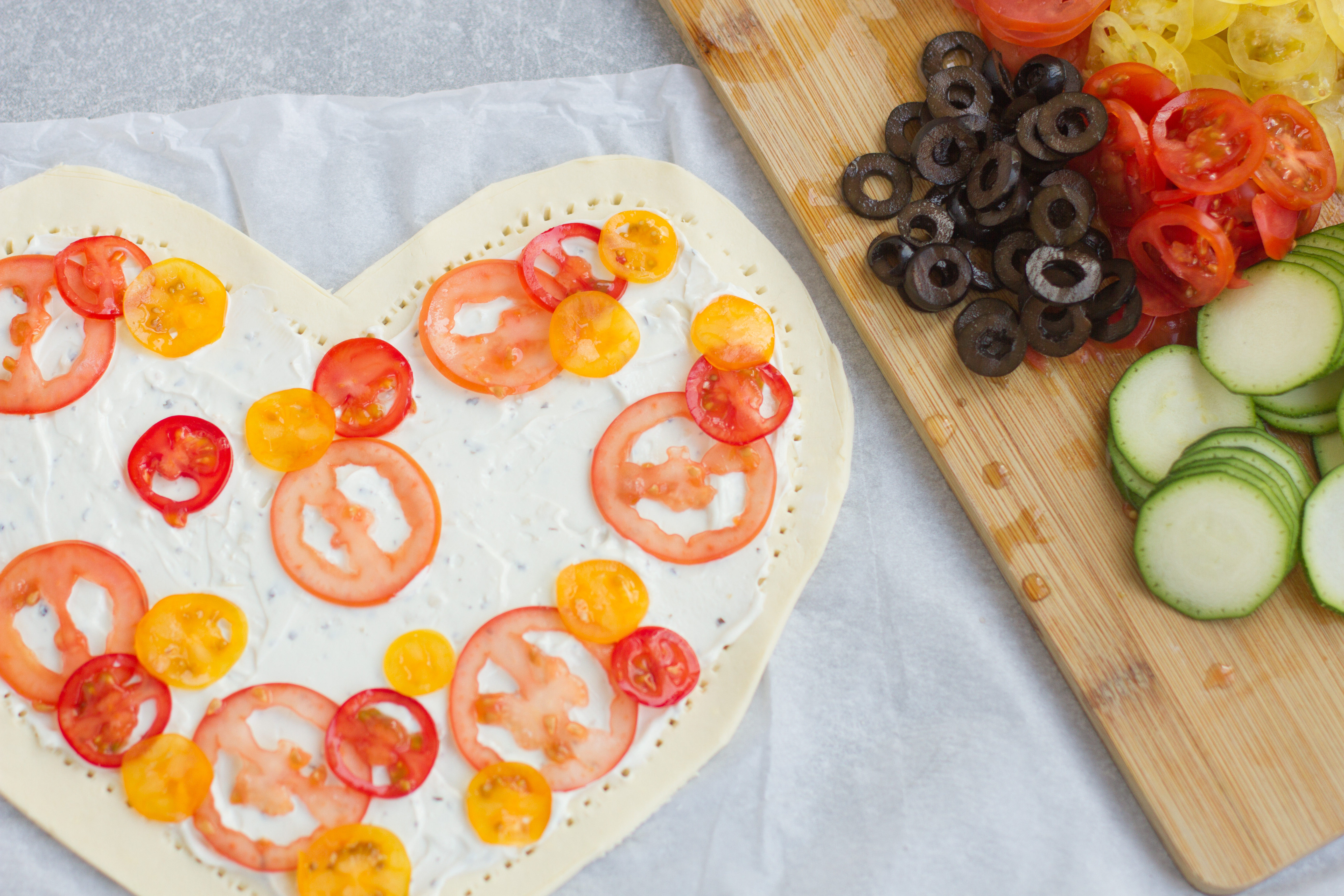 Vegetarian vegan valentines puff pastry pizzas with rainbow tomatoes