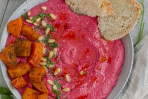 A delicious, creamy butternut squash and beet hummus. This easy hummus recipe is vegan, gluten-free, and made low-FODMAP by the use of garlic-infused olive oil